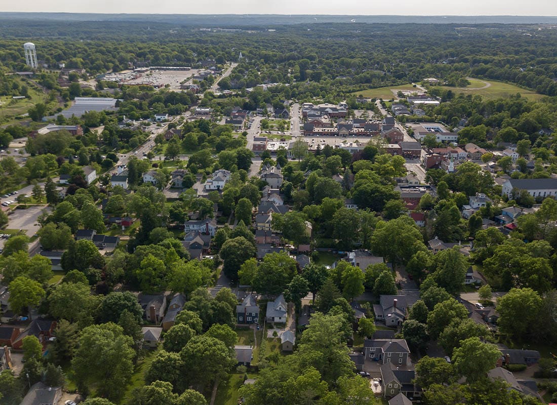 Granville, OH - Aerial View of Hudson, Ohio With Lush Trees and Commercial Buildings and Houses